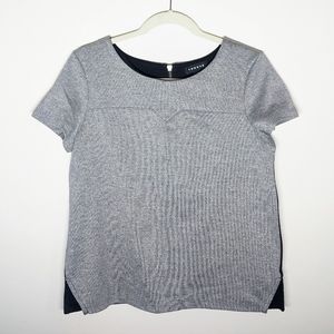 Metallic silver and black zipper-back top